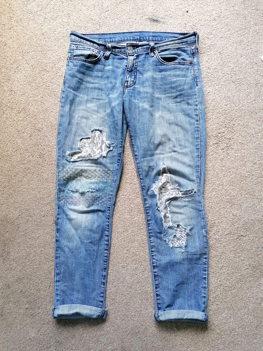 Advice for fixing new jeans: Brand new pair of jeans had the decorative  thread come undone near the left pocket (See photo). Any suggestions on how  to mend it? I have access